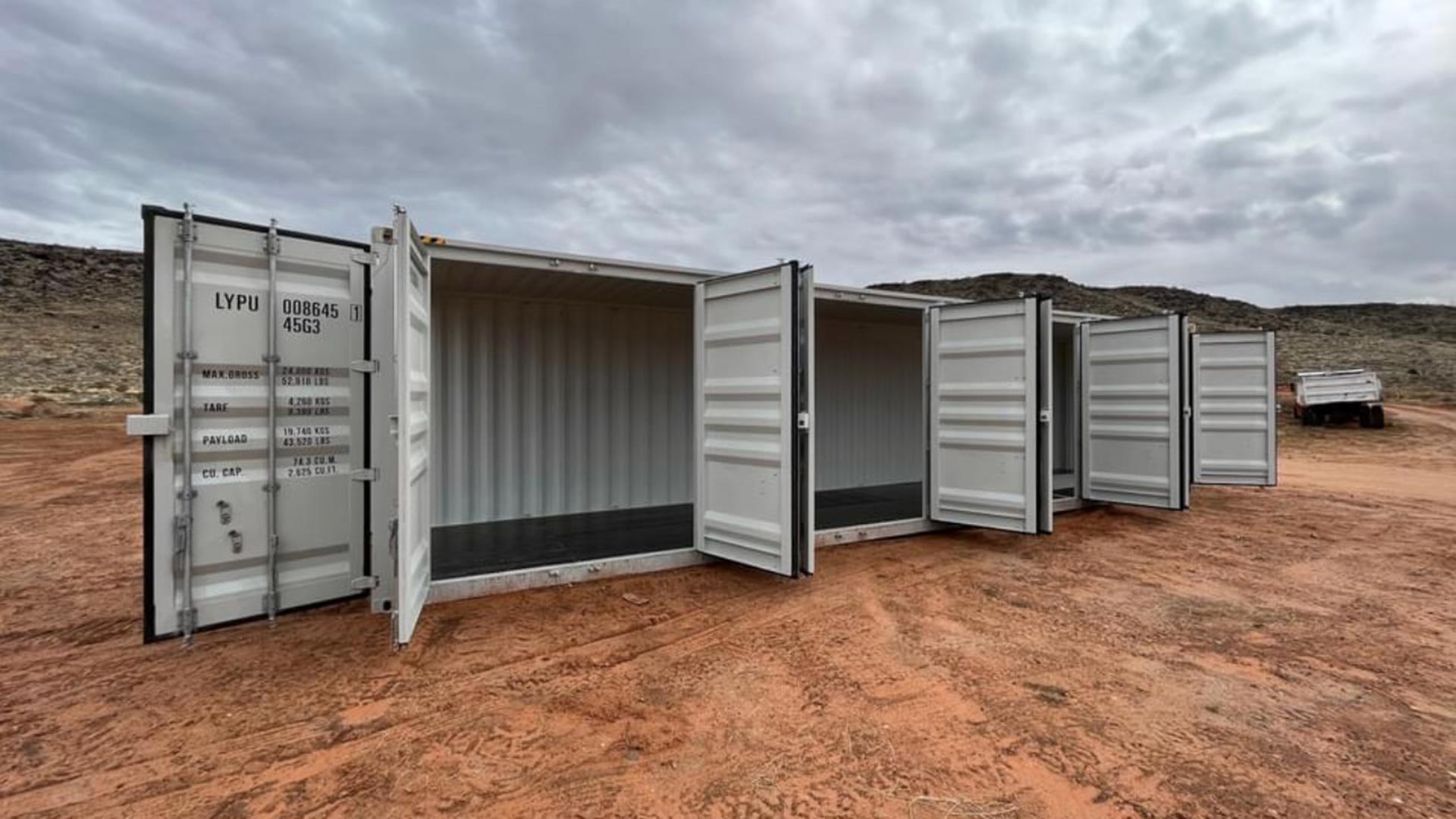 Angled view along the container’s open side-access doors