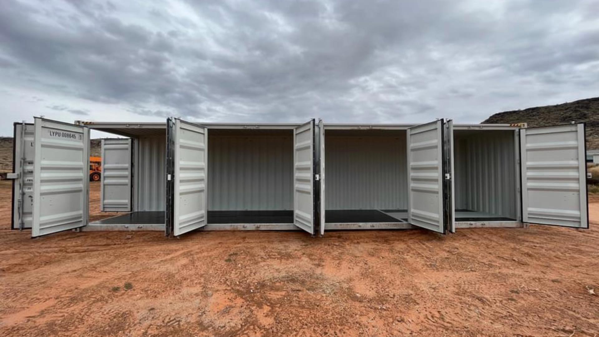 Four-door open-side container with all side-access openings open.